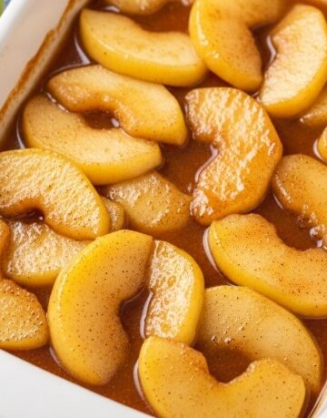 Fried Apples Recipe in White Baking Dish with Cinnamon Glaze